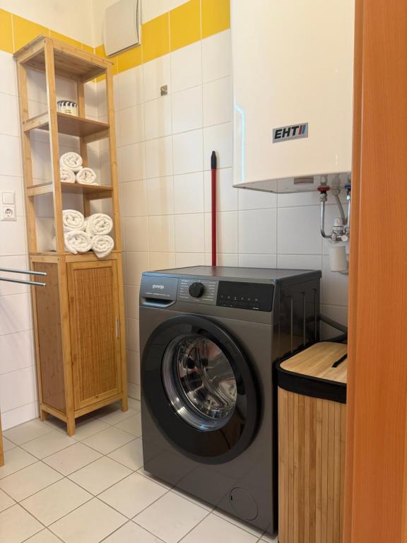 Bathroom with washing machine Apartment D01
