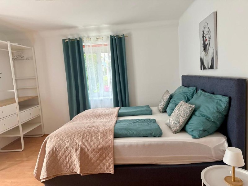 Bedroom with turquoise accents Apartment D01